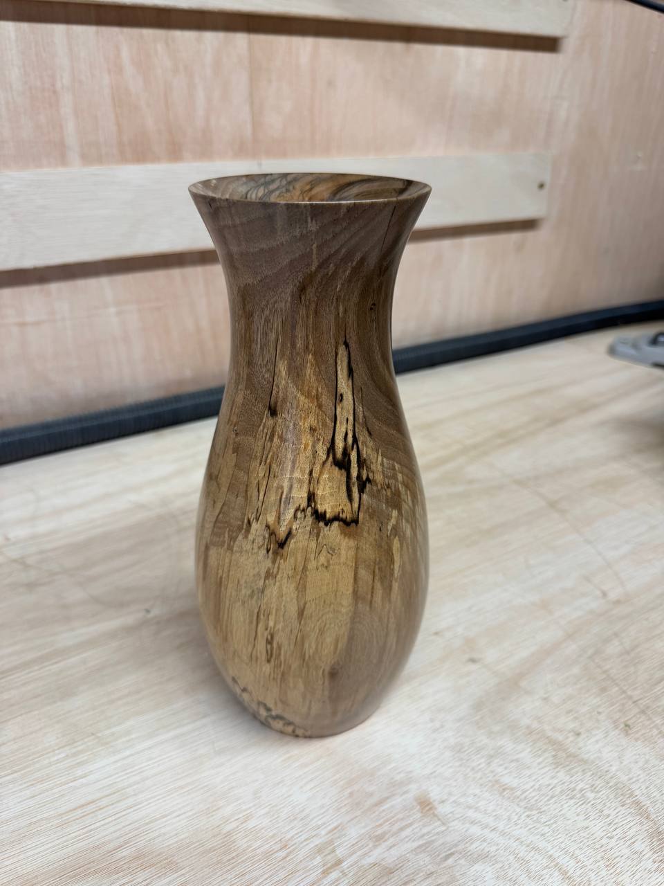 The finished vase — rear view showing the spalting
